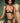 Woman wearing the Coco de Mer Arletta quarter cup bra with matching embroidered thong in emerald green.