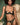 Woman wearing the Coco de Mer Arletta quarter cup bra with matching embroidered thong in emerald green.