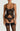 Black botanical embroidered basque with underwired balconette cups, velvet waistband, and suspender straps, worn with a matching thong