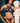 Woman wearing the Coco de Mer Tamara high neck lace bustier with matching Brazilian brief in sapphire blue French Leavers lace.