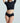 Model wearing a black crop top and high-waisted black Butter Hipster by Commando