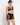 Model wearing Desir Et Volupté push-up triangle bra with floral embroidery and scalloped neckline in black