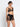 Model wearing Desir Et Volupté push-up triangle bra with floral embroidery and scalloped neckline in black