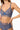 model wearing the Else Bella soft triangle bra in lapis(blue) with wireless unlined cups and longline mesh band