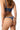 back view of model wearing the Else Bella thong with minimal coverage and string sides in lapis(blue)