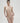 Essentiel nude seamless strapless bra with underwire and molded cups, microfiber comfort, and multi-way straps for versatile styling.
