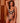 Model wearing Onyx Bodysuit with plunging neckline and embroidered Italian tulle