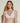 Forte white wireless bralette with French floral lace, plunge neckline, scalloped edges, and soft triangle cups for a bold, feminine look.