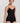 HANRO black seamless V-neck camisole in mercerized cotton with satin trim and adjustable straps, perfect for layering or wearing alone.
