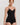 HANRO black seamless V-neck camisole in mercerized cotton with satin trim and adjustable straps, perfect for layering or wearing alone.