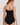 HANRO black seamless V-neck camisole in mercerized cotton with satin trim and adjustable straps, perfect for layering or wearing alone.