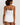 HANRO white seamless V-neck camisole in mercerized cotton with satin trim and adjustable straps, perfect for layering or wearing alone.