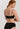HANRO Touch Feeling black spaghetti strap crop top in soft microfiber with seamless finish and light bust support for versatile wear.