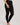 Model wearing Hanro Woolen Silk Long Leg in black showing full length and elastic waistband