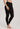 Model wearing Hanro Woolen Silk Long Leg in black showing full length and elastic waistband