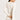 Back view of model wearing a women’s wool-silk long-sleeve thermal top in cygne by Hanro.