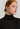 Close-up of Hanro Woolen Silk Turtleneck in black showing fine wool-silk blend and flat trim