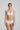 White Heart-shaped padded foam bra in soft white with seamless finish, underwire support, and multi-way straps.
