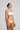White Heart-shaped foam cup bra with daisy straps and silicone-backed support, convertible to halter or shoulder style.