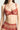 Close-up of red floral lace balconette bra cup with scalloped edge and sheer mesh center