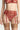 Close-up of red floral lace suspender belt with adjustable garter straps and metal clips