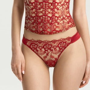Close-up of red floral lace thong front panel with satin side straps