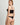 Back view of the I.D. Sarrieri Love Potion Underwired Half Cup Bustier showcasing the hook-and-eye closure, adjustable straps, sheer mesh back panels, and longline construction.
