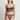 Model wearing the I.D. Sarrieri Love Potion Underwired Half Cup Bustier in black featuring embroidered tulle, stretch silk, underwired half cups, adjustable straps, and a longline silhouette.