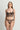 Model wearing the I.D. Sarrieri Love Potion Underwired Half Cup Bustier in black featuring embroidered tulle, stretch silk, underwired half cups, adjustable straps, and a longline silhouette.