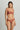 Model wearing the Memories of Love thong by I.D. Sarrieri in dark red showing embroidered lace design