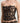Black floral lace bustier with scalloped neckline and sheer mesh side panel