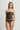 Strapless black lace bustier with boned corset seaming, worn with matching lace brief
