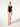 model wearing the Jamaika string body in black by Wolford with a scoop neckline and seamless fit