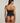 Je M'appelle Sophie strapless bustier in black, silk blend with structured fit and soft sheen.