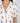 Jolene Hummingbirds print short pajama set with orange piping, short-sleeve top, and longer shorts in soft bamboo fabric.