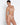 Model wearing Lise Charmel Revelation Beauté wireless non-padded tulle bra in beige crafted from sheer tulle
