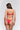 Back view of model wearing red lace Italian briefs with minimal back coverage and orange straps