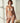 Marie Jo Rio briefs in beige with feather-light fabric, seamless back, Brazilian cut, and elegant pearl strap detail.