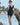 Back view of model wearing Angele slip with wide straps and v-neckline in black.