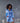 Model wearing Marjolaine Betty Silk Satin Short Robe in Bleu Ciel with crossover neckline and waist belt