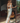 Back view of Marjolaine Carmela Long Dress featuring an open-back silk satin design in white and silver.