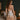 Back view of the Marjolaine Daisy Floral Silk Nightdress in nude showcasing the floral lace back, stretch silk satin, adjustable spaghetti straps, delicate floral print, and an elegant above-the-knee fit.