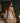 Back view of the Marjolaine Daisy Floral Silk Nightdress in nude showcasing the floral lace back, stretch silk satin, adjustable spaghetti straps, delicate floral print, and an elegant above-the-knee fit.