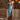 Woman wearing the Marjolaine Diane Long Silk Nightdress in aqua blue with burgundy floral lace and a high side slit.
