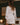 Back view of the Marjolaine Tess Short Silk Robe in ivory showcasing smooth silk satin, elegant lace cuffs, long sleeves, and a flattering short wrap silhouette with a self-tie belt.