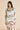 Silk long pajama set in Maugham floral print with pearl buttons, olive piping, and a notched collar for timeless luxury and comfort.