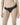 Model wearing black NUEAME Brazilian Flower Lace Briefs with smooth panel and lace sides.