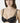 Model wearing black NUEAME Underwire Lace Balcony Bra with floral lace cups and double straps.