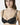 Model wearing black NUEAME Underwire Lace Balcony Bra with floral lace cups and double straps.