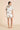 Olivia von Halle Ingo Cora ivory silk short pajama set with goldfish print and black piping from the back